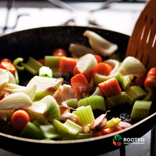 Aromatic vegetables cooking in a wok