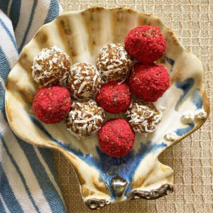 Date bites arranged on a shell plate