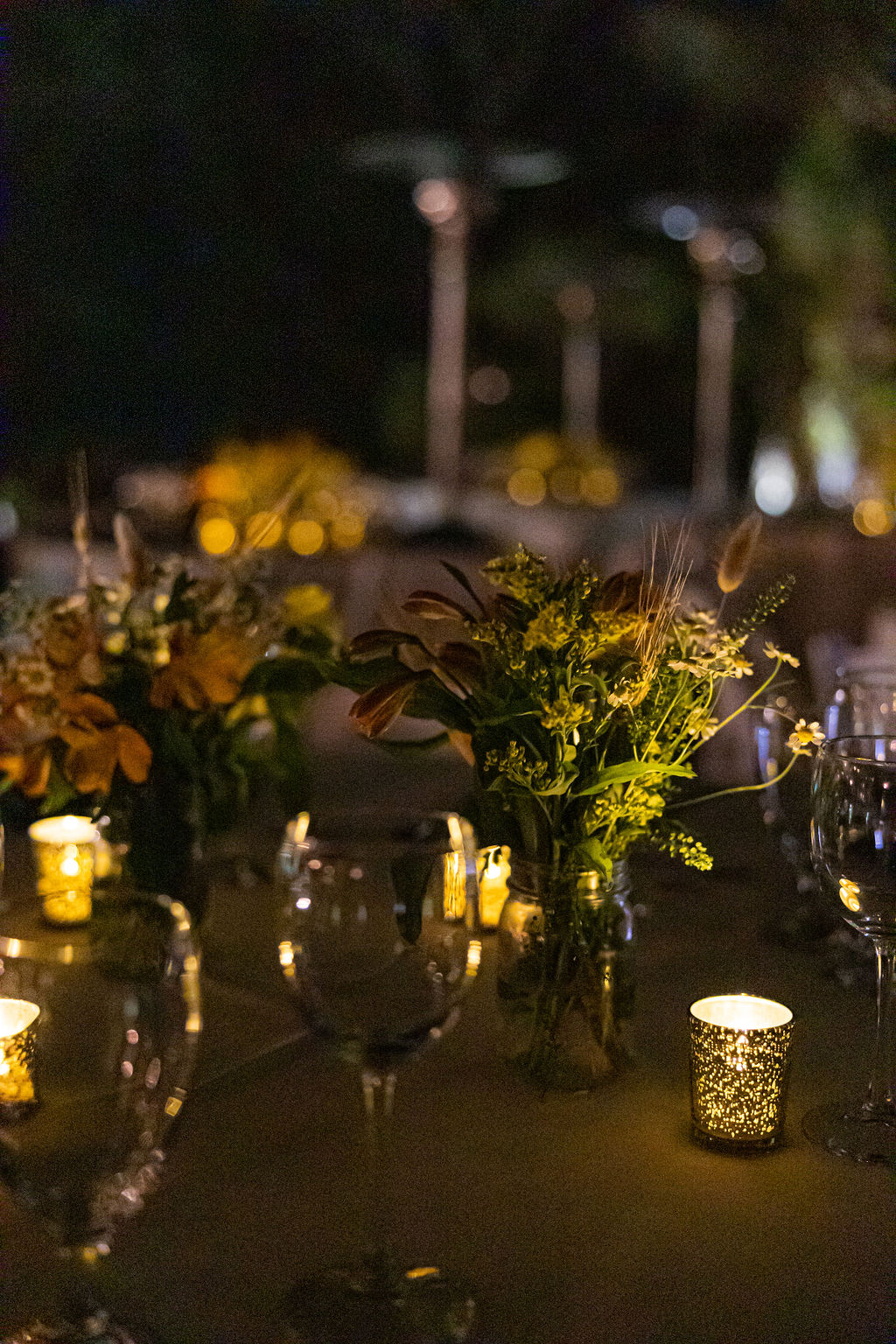 Flowers, wine glasses and candlelight