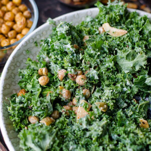 Kale and chickpea salad in a white bowl